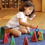 Skipwith Academy - Montessori preschool childcare - girl learning with educational toys