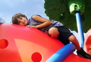 Skipwith Academy Colonial Heights school age child on playground equipment - childcare in Colonial Heights Virginia, including infant and toddler daycare, preschool, before and after school care, and more